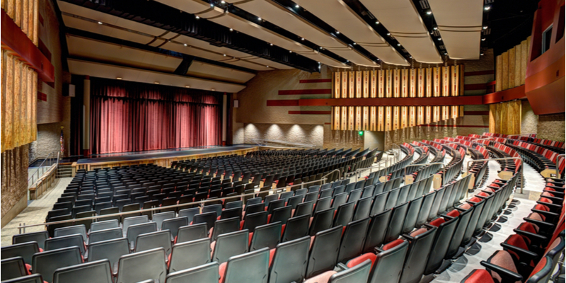 A huge, spacious auditorium with a great interior design, as well as ample rows of seating.